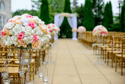 Guests standing and cheering as the newlyweds walk down the aisle